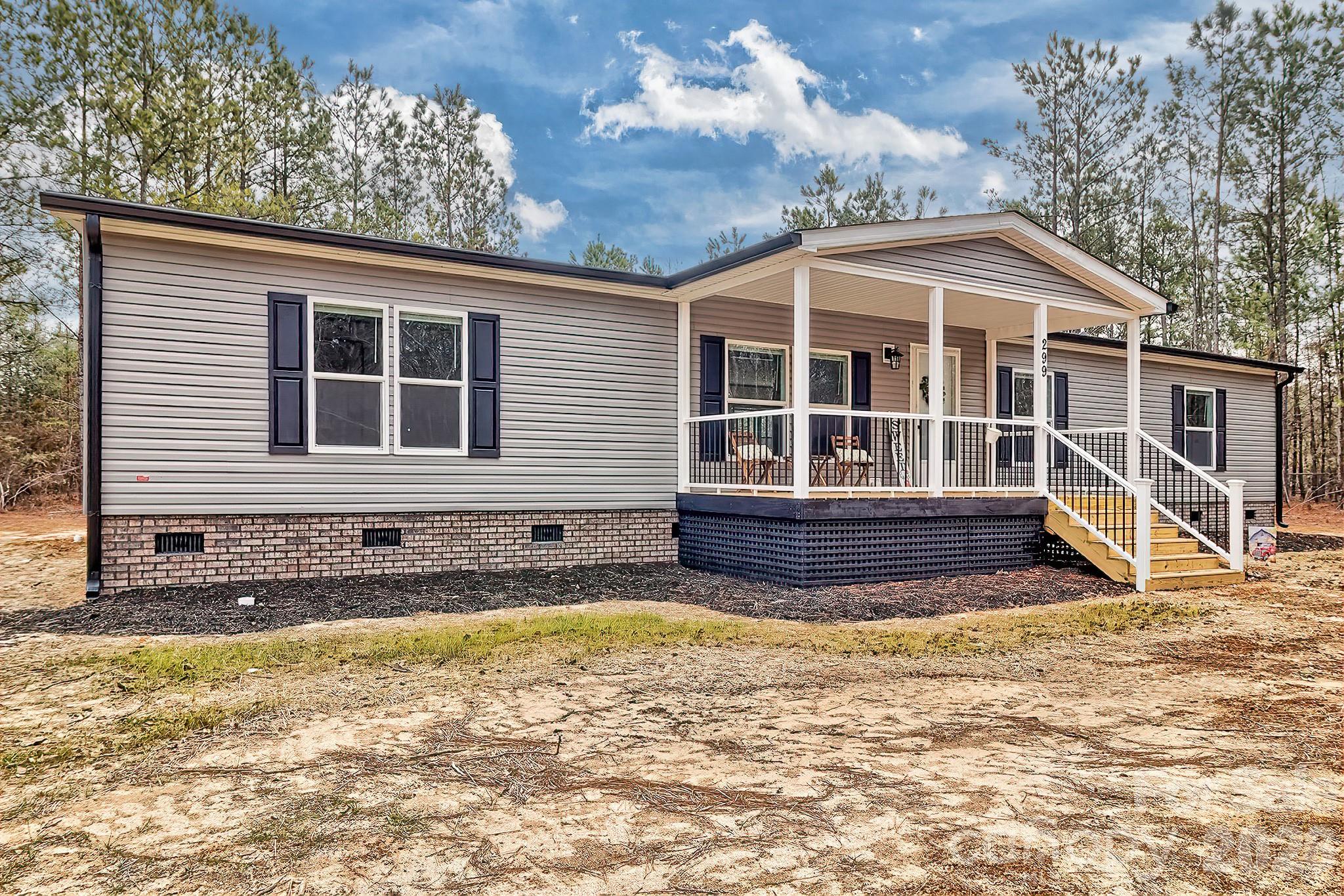 299 Ned Williams Road Kershaw, SC 29067 - Photo 2 of 43 a front view of a house with a yard