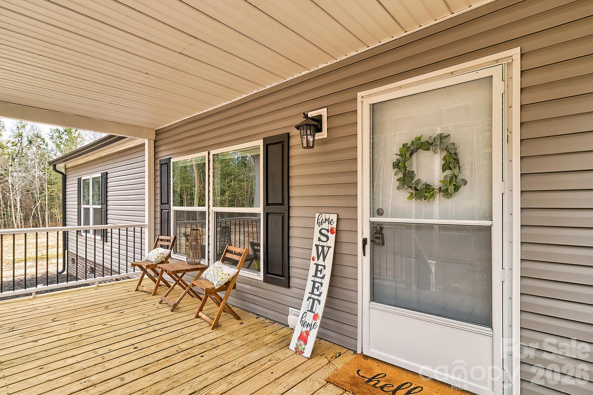 299 Ned Williams Road Kershaw, SC 29067 - Photo 3 of 43 a porch with seating space and balcony