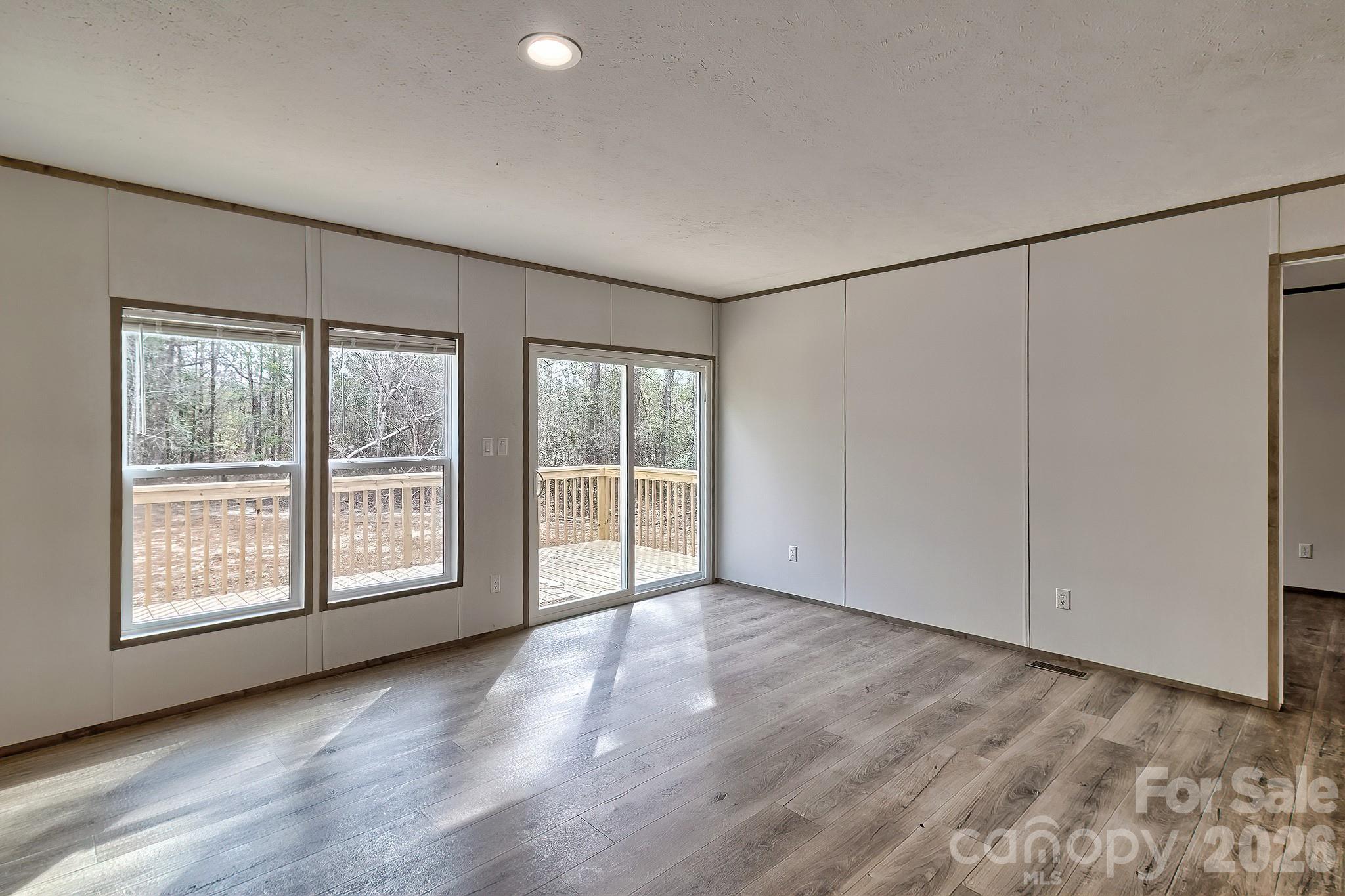 299 Ned Williams Road Kershaw, SC 29067 - Photo 34 of 43 wooden floor in an empty room with a window