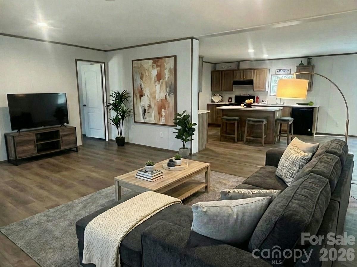 299 Ned Williams Road Kershaw, SC 29067 - Photo 8 of 43 a living room with furniture and a flat screen tv