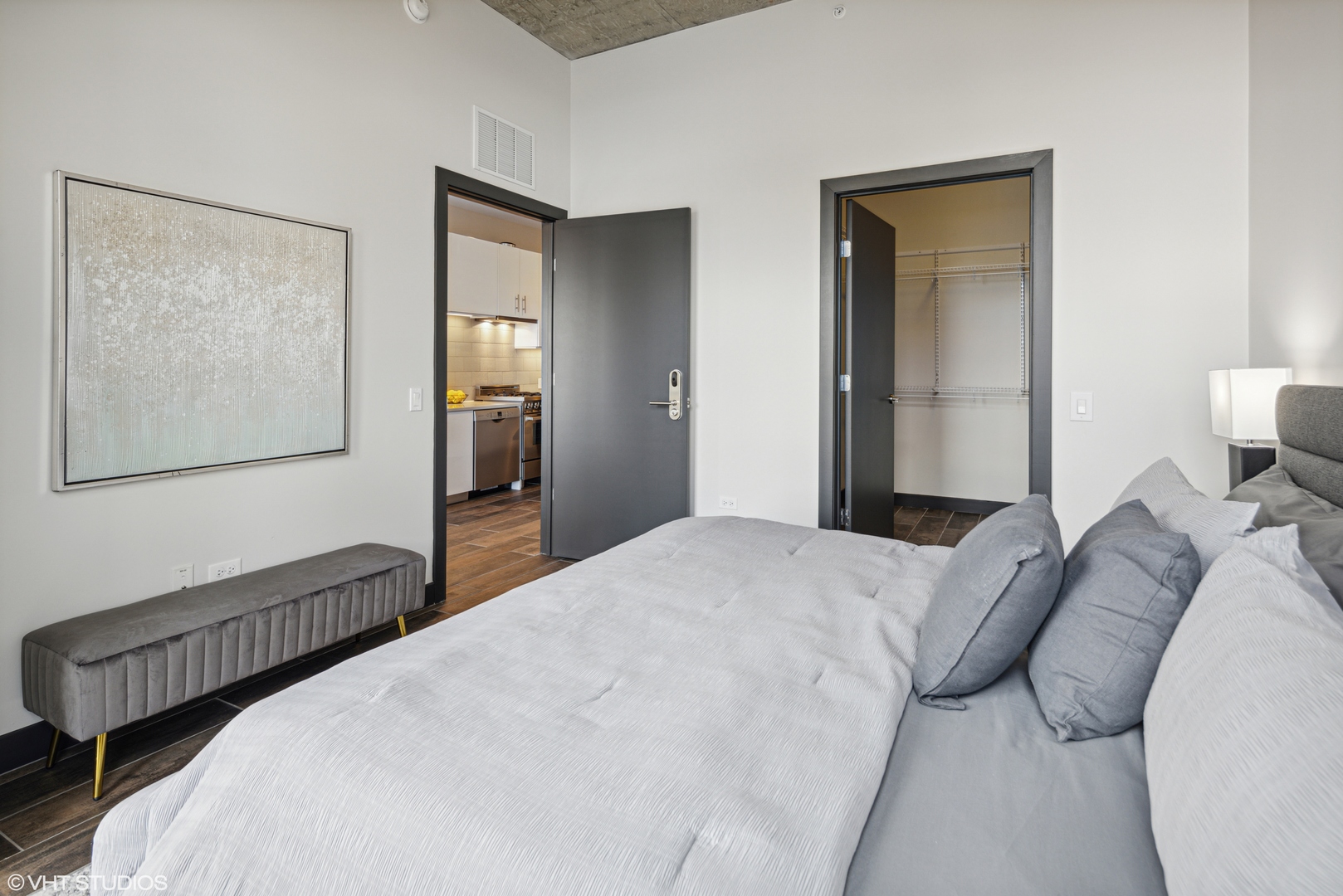 171 North Aberdeen Street, Unit 814 Chicago, IL 60607 - Photo 11 of 22 a bedroom with a bed and a painting