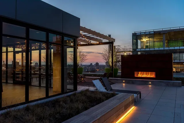 a living room with fireplace furniture and a flat screen tv
