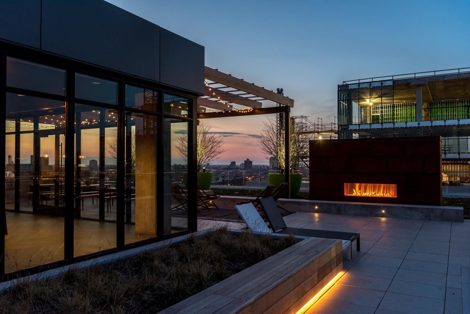 171 North Aberdeen Street, Unit 814 Chicago, IL 60607 - Photo 20 of 22 a living room with fireplace furniture and a flat screen tv
