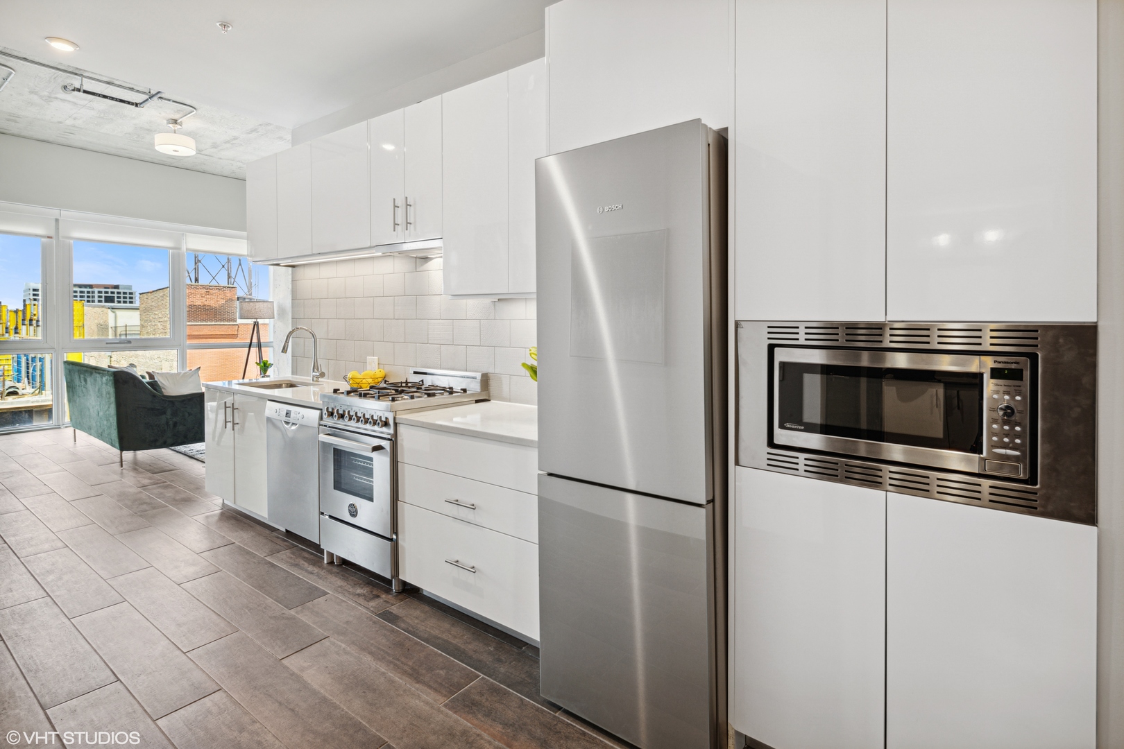 171 North Aberdeen Street, Unit 814 Chicago, IL 60607 - Photo 6 of 22 a kitchen with a refrigerator and a stove top oven
