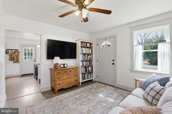 a living room with furniture and a window