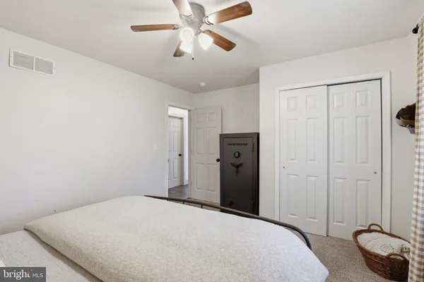 a bedroom with furniture and a window
