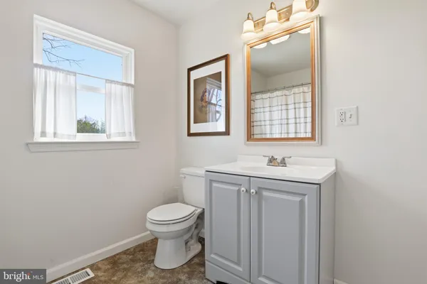 a white bath tub sitting next to a window