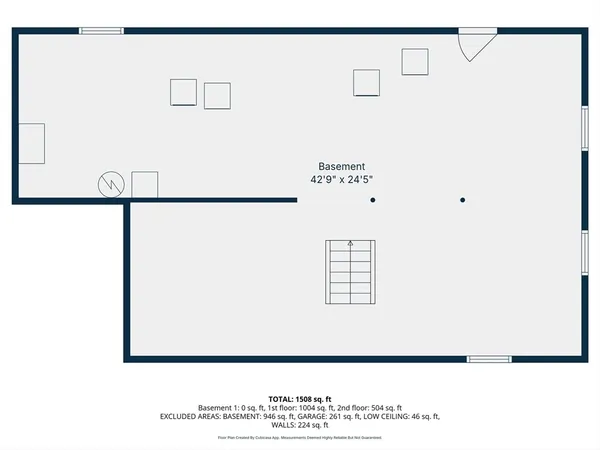 a picture of a room with a white wall and a refrigerator