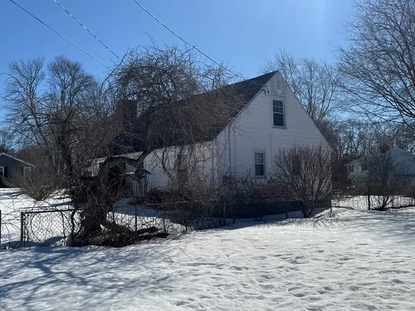 a view of a house covered in snow