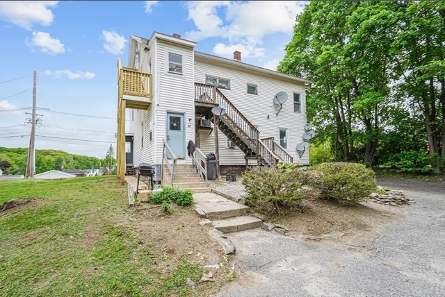 a view of a house with a yard and plants
