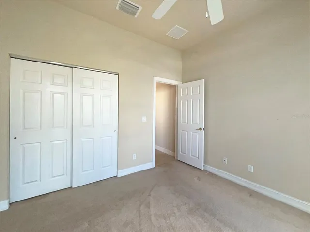 a view of a hallway with staircase