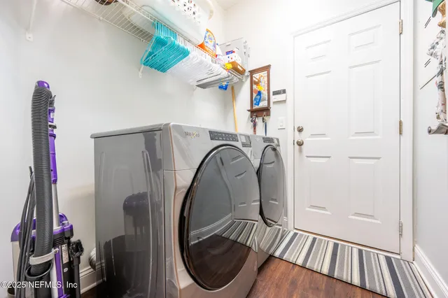 a balcony with furniture and a potted plant