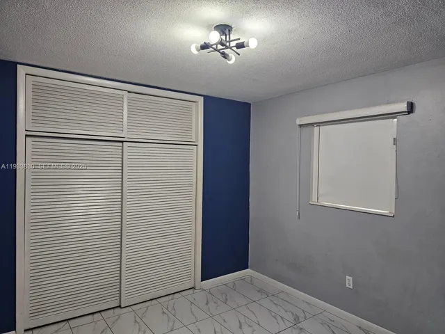 a view of empty room with closet