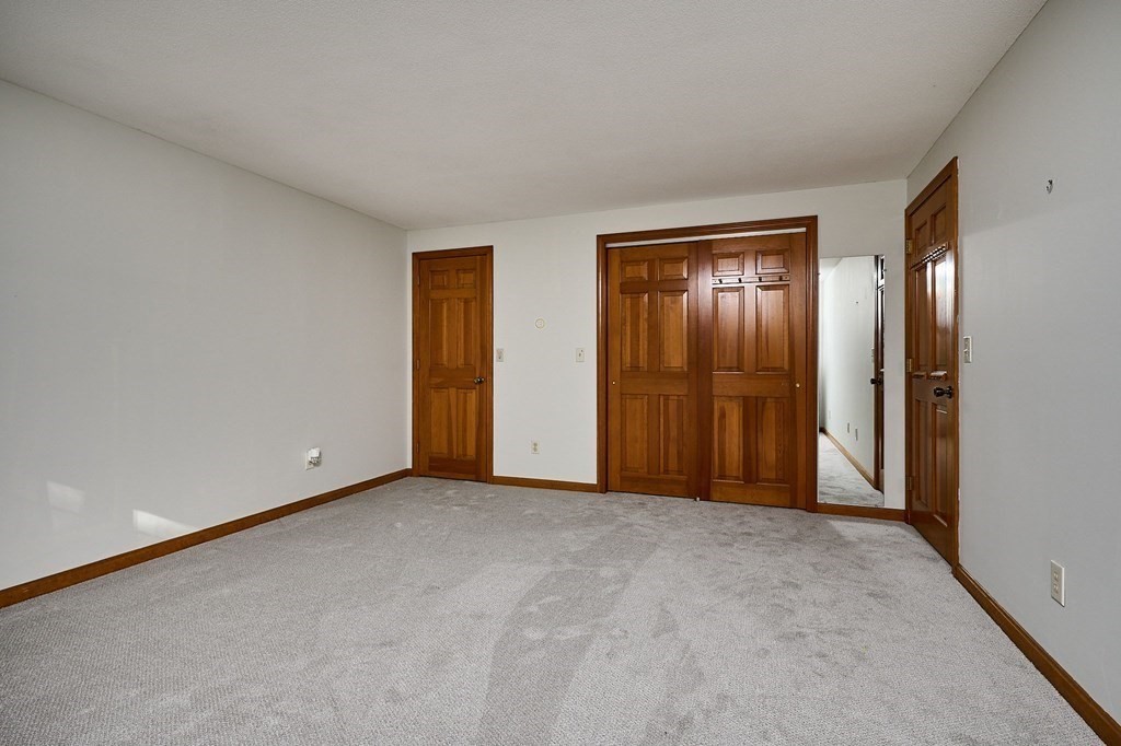 22 Ashley Circle Easthampton, MA 01027 - Photo 31 of 42 a view of an empty room and closet area