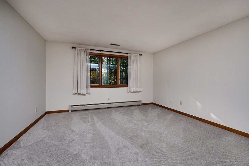 22 Ashley Circle Easthampton, MA 01027 - Photo 32 of 42 a view of an empty room with a window