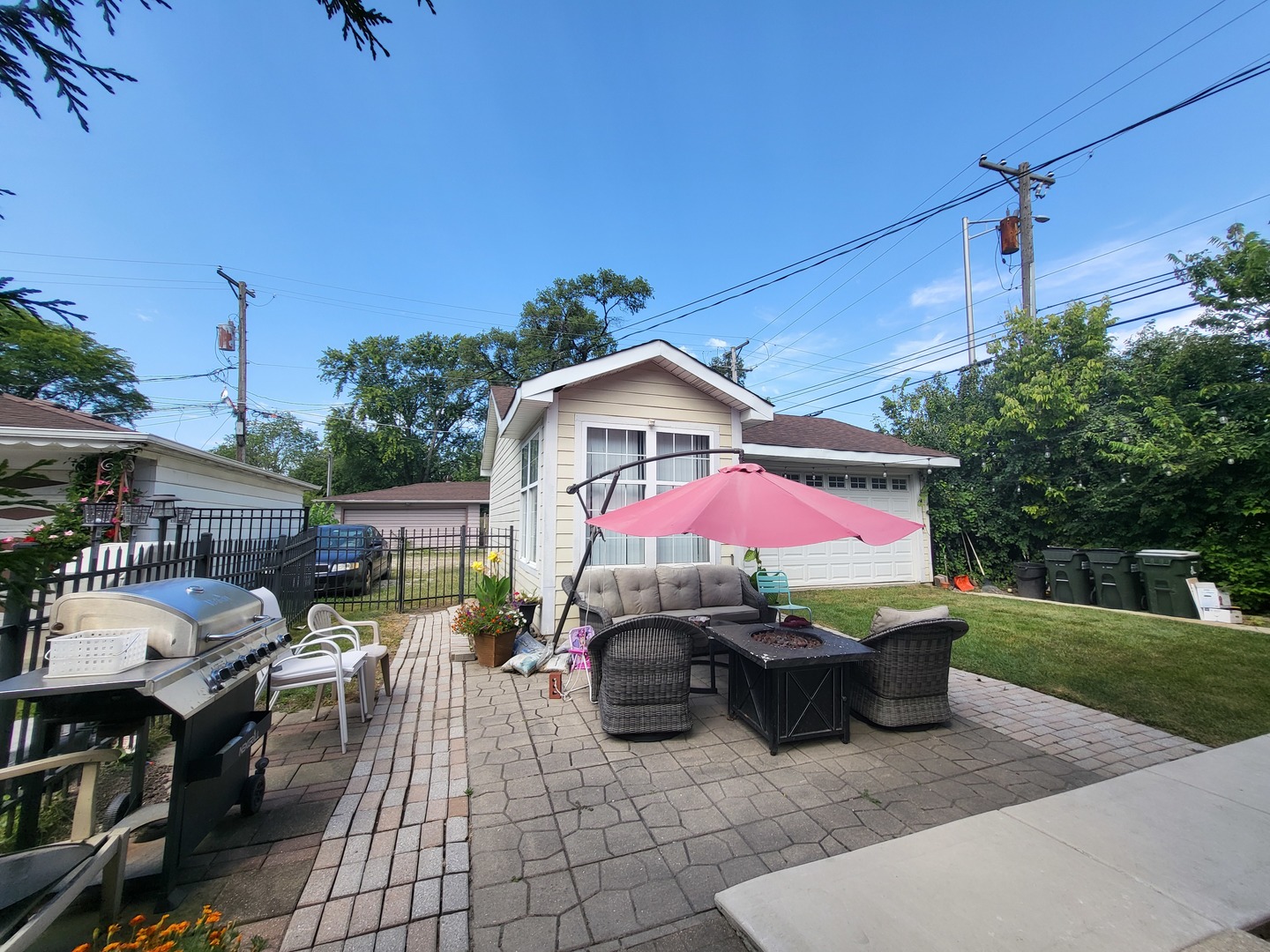 472 Northgate Court Riverside, IL 60546 - Photo 22 of 23 a view of a patio with table and chairs under an umbrella
