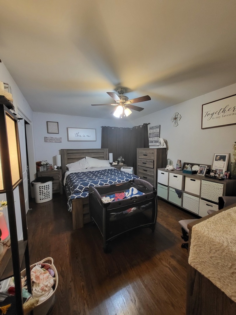 472 Northgate Court Riverside, IL 60546 - Photo 10 of 23 a bedroom with furniture and a wooden floor