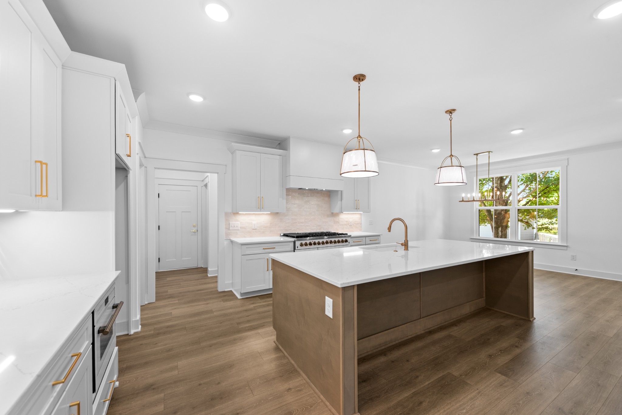 112 Stoneybrook Road Columbia, TN 38401 - Photo 18 of 47 a kitchen with a sink stove and wooden floor