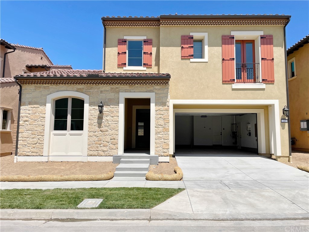 a front view of a house with garage