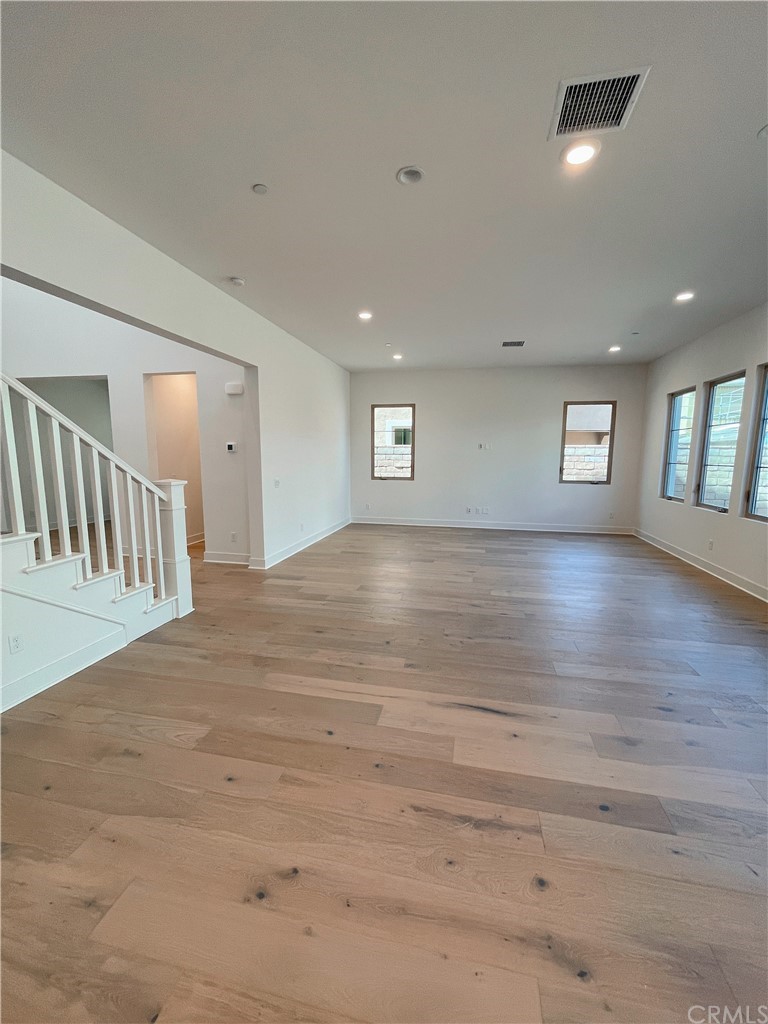 215 Sutters Mill Irvine, CA 92602 - Photo 26 of 57 a view of empty room with wooden floor