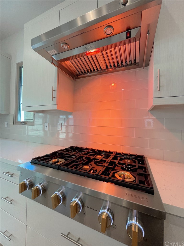215 Sutters Mill Irvine, CA 92602 - Photo 4 of 57 a stove top oven sitting inside of a kitchen