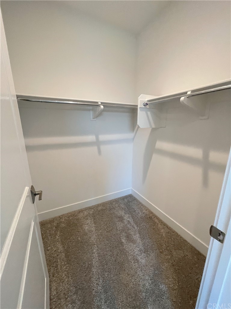 215 Sutters Mill Irvine, CA 92602 - Photo 43 of 57 a view of a room with shelf on the wall