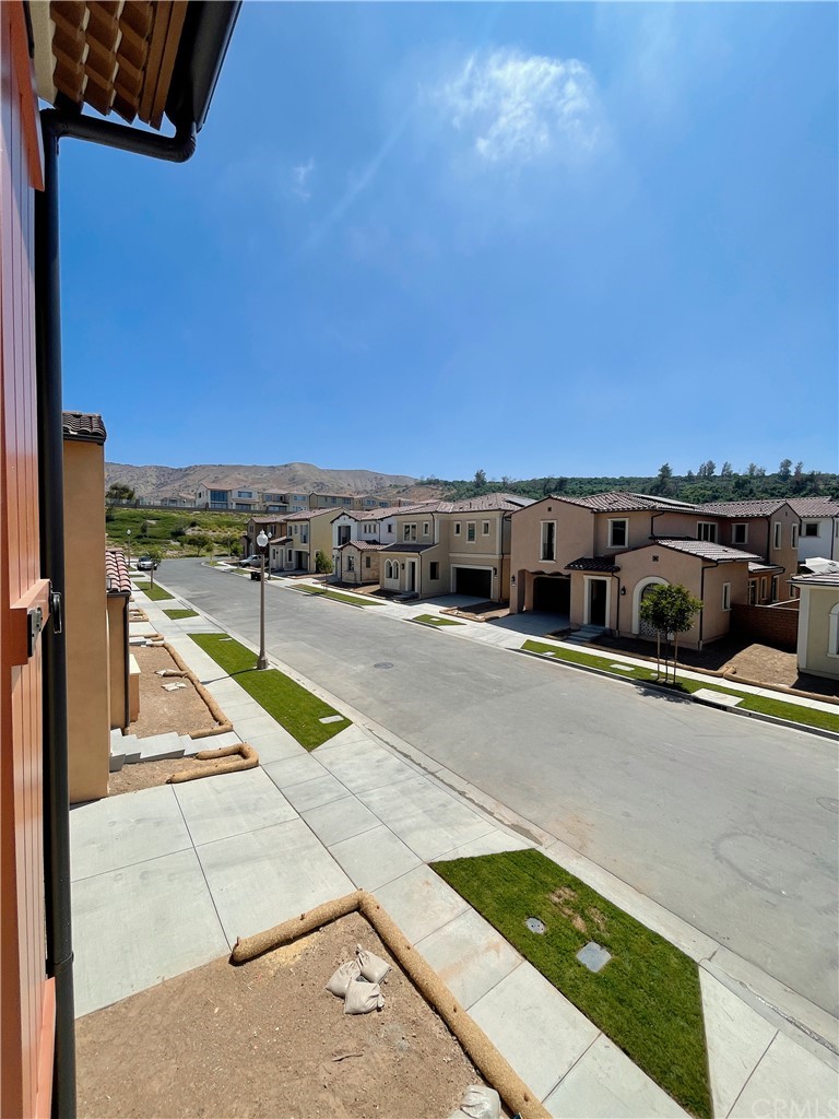 215 Sutters Mill Irvine, CA 92602 - Photo 44 of 57 a view of balcony with two chairs and a table