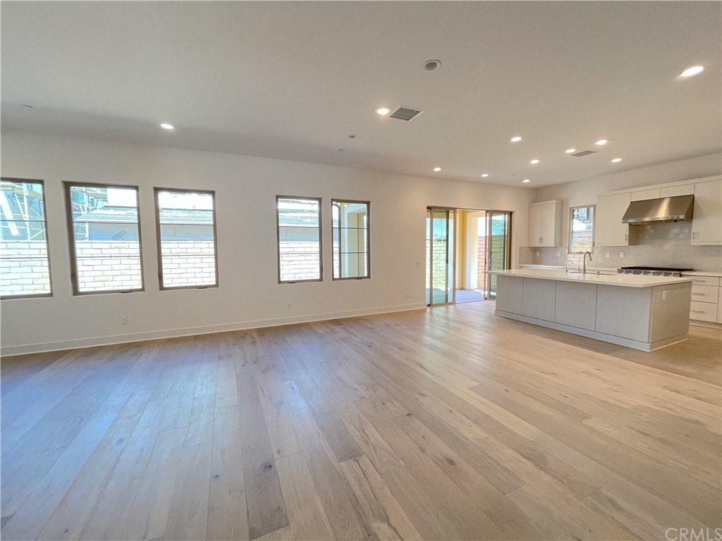 215 Sutters Mill Irvine, CA 92602 - Photo 47 of 57 a view of an empty room with wooden floor and a window