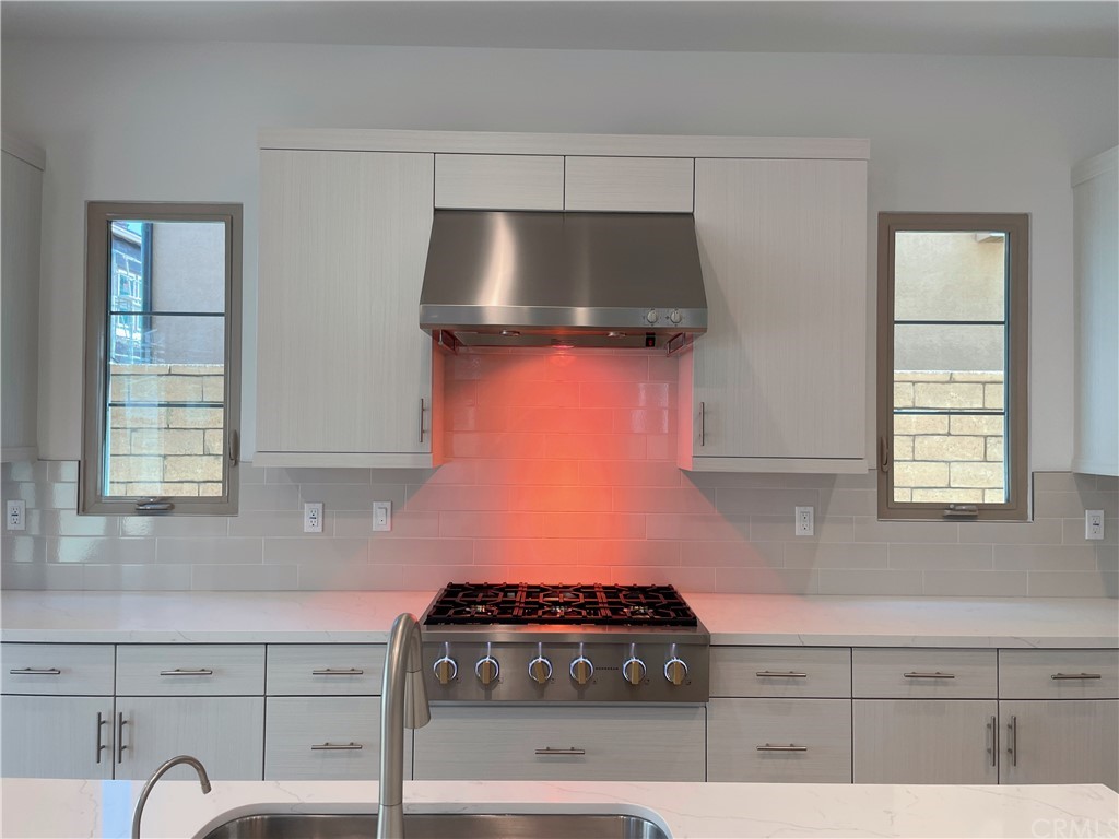 215 Sutters Mill Irvine, CA 92602 - Photo 5 of 57 a kitchen with a stove and cabinets