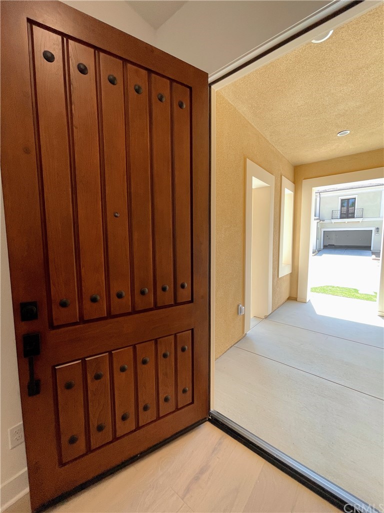 215 Sutters Mill Irvine, CA 92602 - Photo 6 of 57 a view of a closet with wooden floor