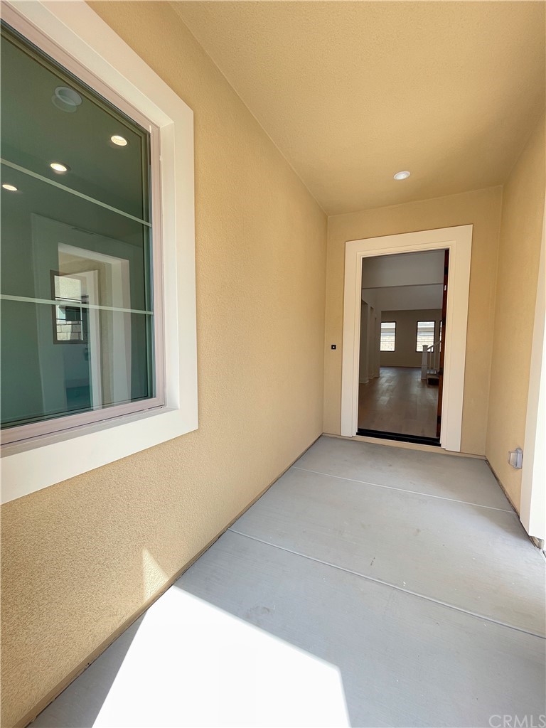 215 Sutters Mill Irvine, CA 92602 - Photo 7 of 57 a view of an empty room with a window and fire place
