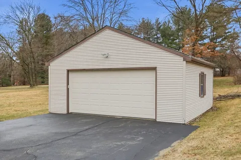 a view of garage yard and garage