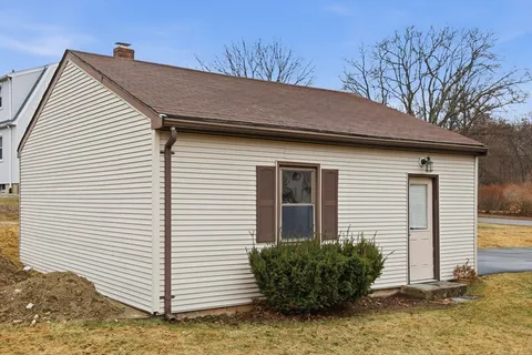 a view of a house with a small yard