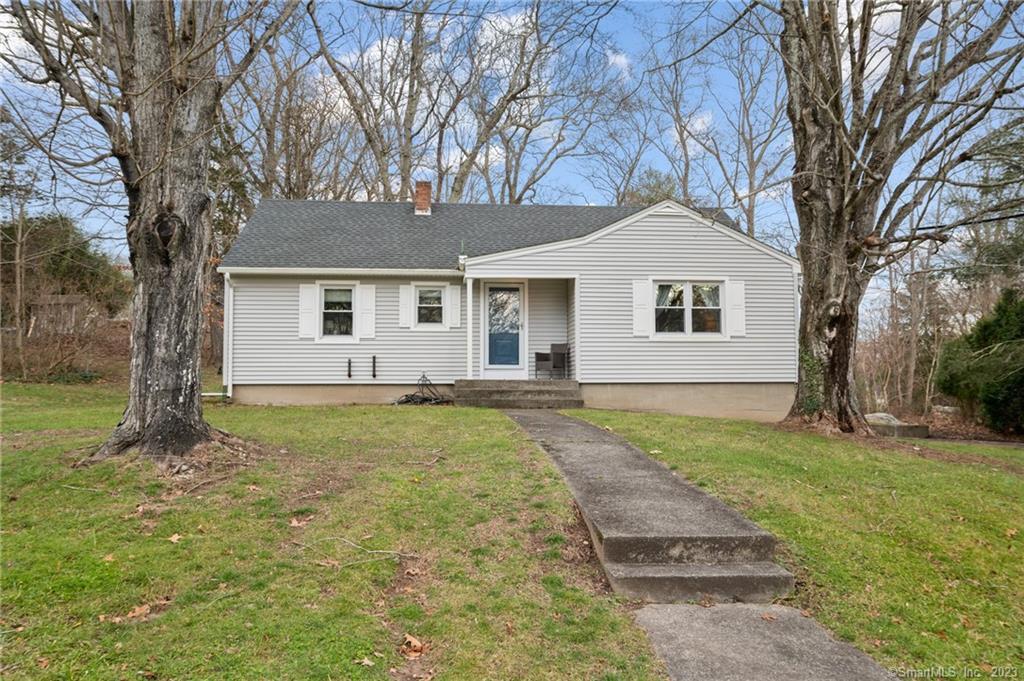 86 Spring Valley Road Groton, CT 06355 - Photo 1 of 1 a backyard of a house with table and chairs