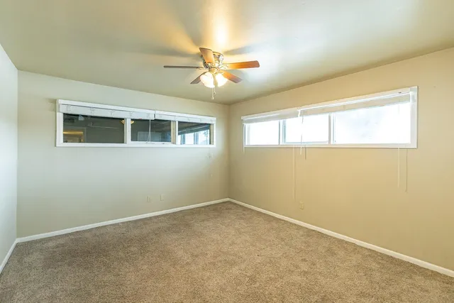 a view of an empty room with a window