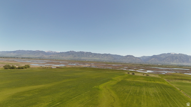 320 South 5400 West Logan, UT 84321 - Photo 9 of 42 Expansive open fields with distant mountain range backdrop