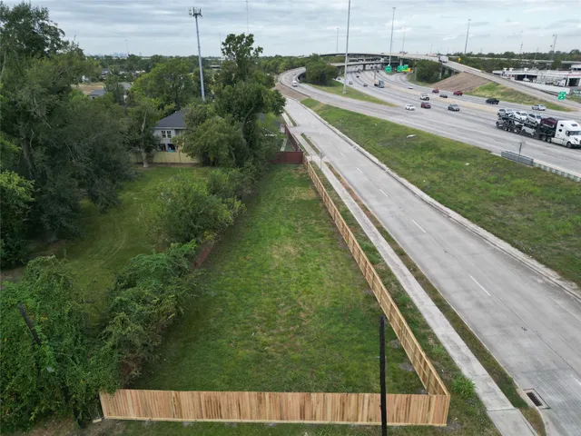 a view of a pool with a yard
