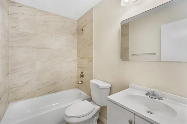 a bathroom with a sink toilet and bathtub