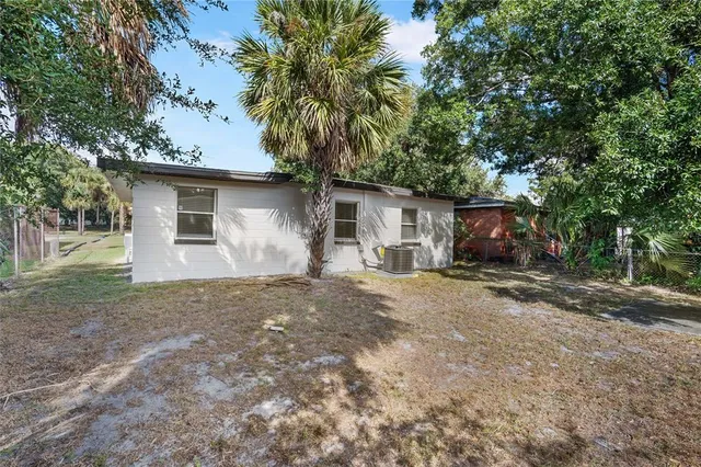 a front view of house with yard and trees