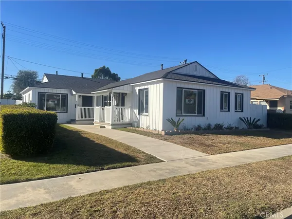 a front view of a house with yard