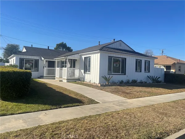 a front view of a house with yard