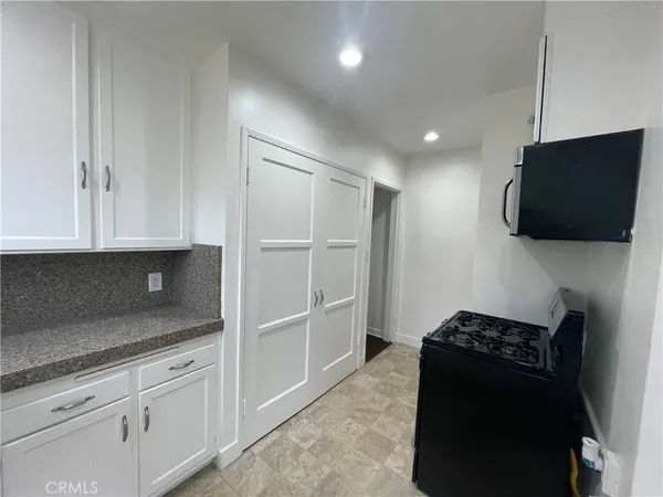 a view of cabinets with wooden floor