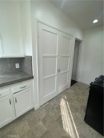 a view of room with window and wooden floor