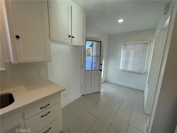 a view of an empty room and closet area