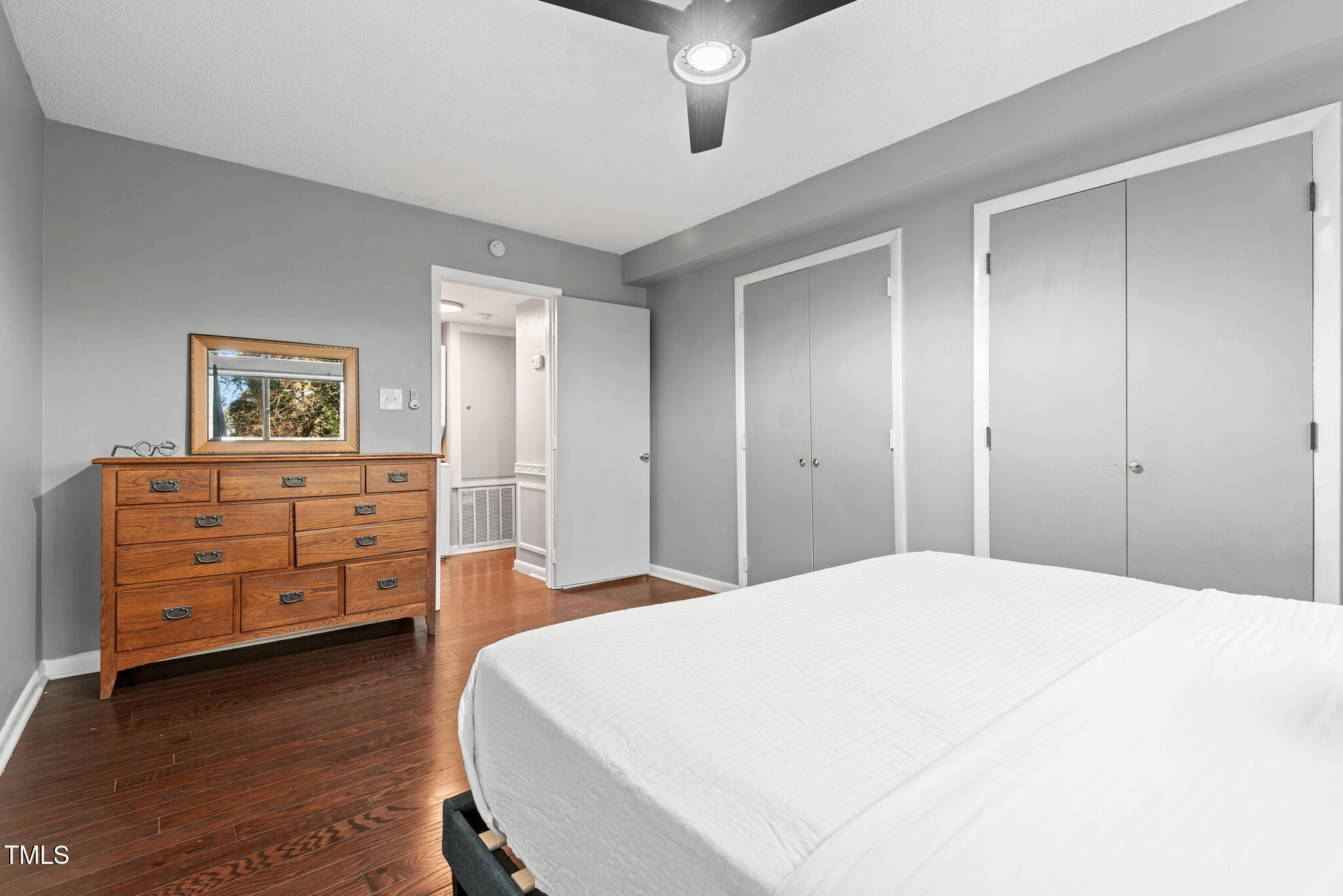 5084 Flint Ridge Place Raleigh, NC 27609 - Photo 12 of 23 a bedroom with a bed and a dresser