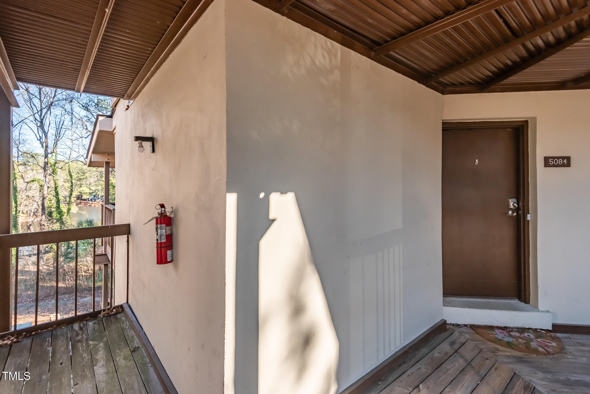 5084 Flint Ridge Place Raleigh, NC 27609 - Photo 17 of 23 a view of hallway with wooden floor and stairs