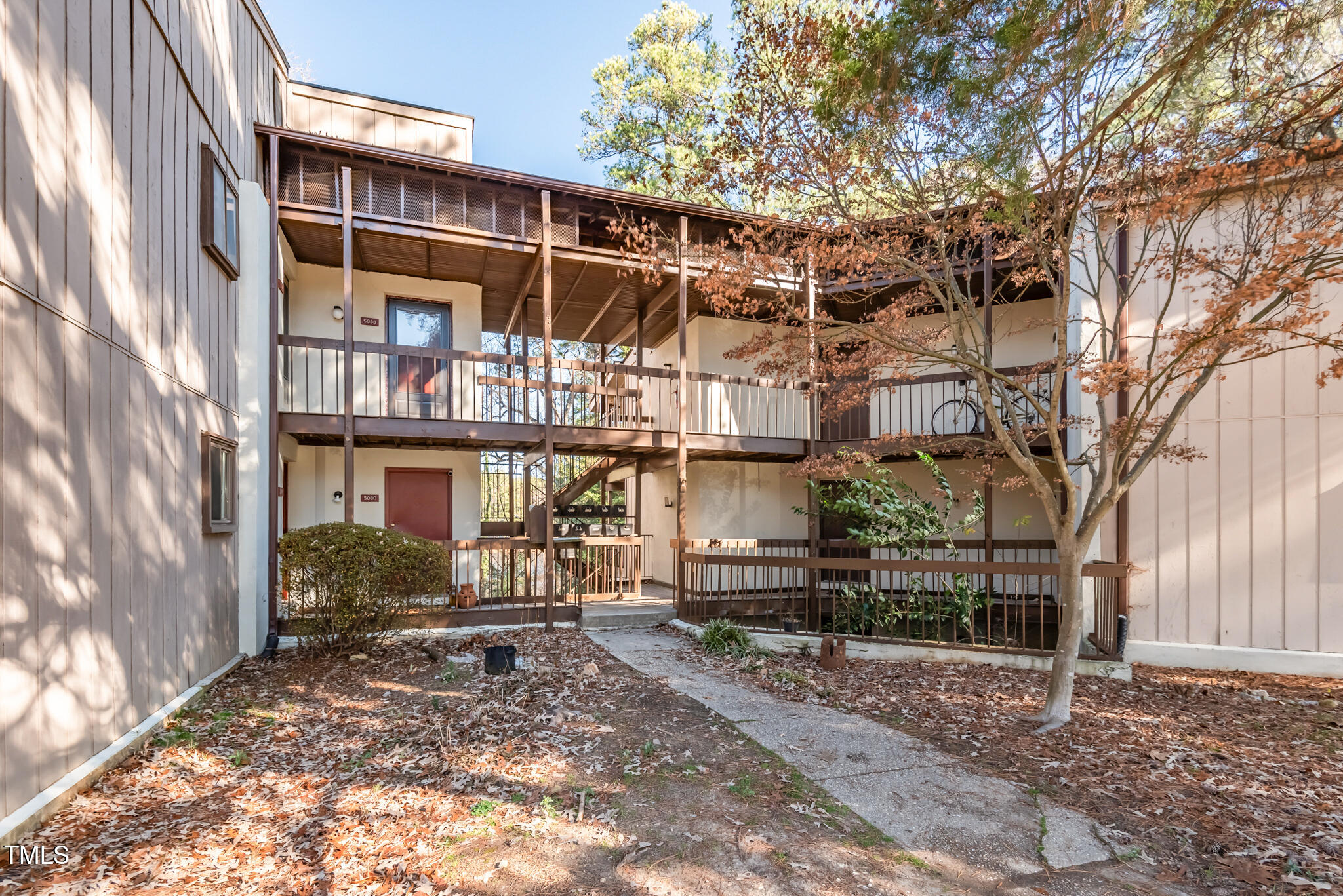 5084 Flint Ridge Place Raleigh, NC 27609 - Photo 18 of 23 a view of a house with a yard