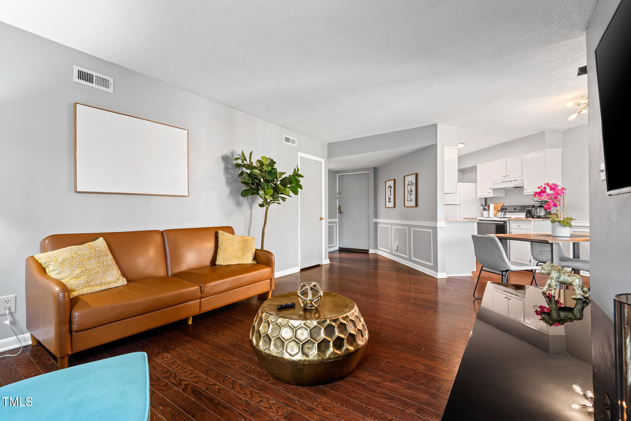 5084 Flint Ridge Place Raleigh, NC 27609 - Photo 5 of 23 a living room with furniture and wooden floor