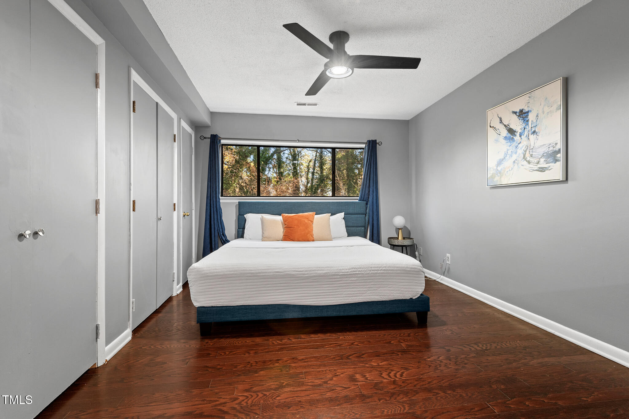 5084 Flint Ridge Place Raleigh, NC 27609 - Photo 10 of 23 a bedroom with a large bed and a window