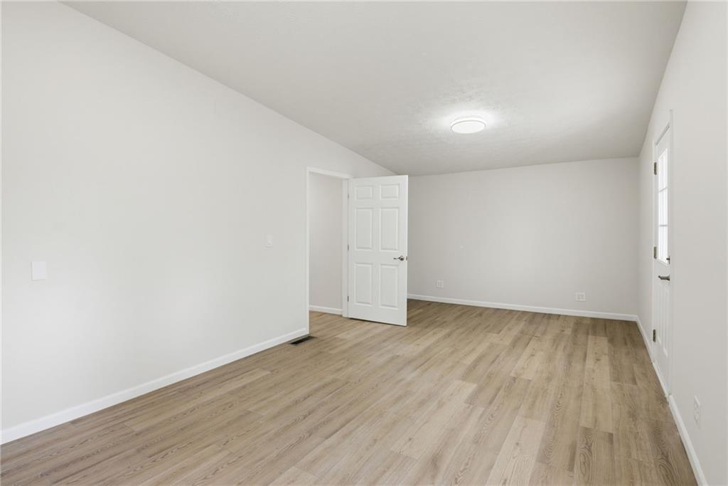 1780 Wynn Lake Road Alto, GA 30510 - Photo 15 of 30 a view of an empty room with wooden floor